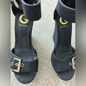 G by Guess Black Open-Toe Heeled wedges / Sandals with Gold Buckles